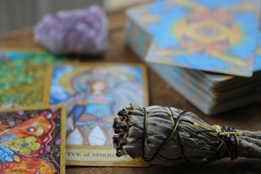 A close-up of a tarot card spread with several reversed cards, illustrating visual cues.